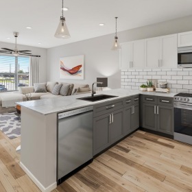 a kitchen with white cabinets
