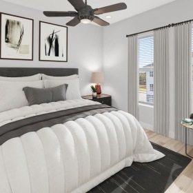 a bedroom with a bed and a fan